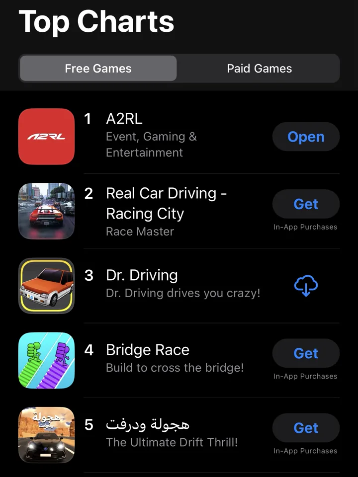 UAE App Store Top Charts showing A2RL at number one in free racing games, above Real Car Driving and Dr. Driving